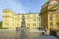 Tourists enter the Charles Bridge Museum near the statue of Charles IV in the Knights of the Cross Square in Prague Czechia