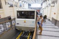 Tourists entering the funicular at Atan Stazione Funicolare Centrale