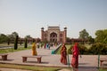 Tourists entering Great Gate to the Taj Mahal