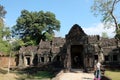 Tourists at the entrance to the medieval abandoned temple of Preah Khan