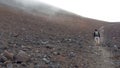Tourists hiking on Etna mountain 