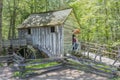 Tourists Examine the Water-Driven Cades Cove Cable Grist Mill Royalty Free Stock Photo