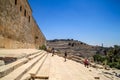 Tourists explore a monumental flight of steps leading up to the second Herodian temple mount, through the Hulda gates with Mount