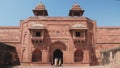 tourists explore a palace at fatephur sikri complex