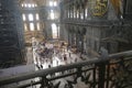 Tourists explore the vast interior of Hagia Sophia