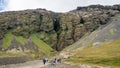 Tourists exploring Rauofeldsgja ravine gorge in Snaefellsbaer, Iceland