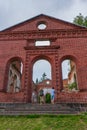 Tourists exploring ruined Lutheran church in Lahdenpohja, Karelia, Russia. Destroyed protestant temple. Architectural landmark in