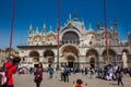 Tourists at the famous Saint Mark Square of Venice in a beautiful sunny early spring day Royalty Free Stock Photo