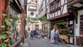Tourists in the narrow, medieval, cobblestone shopping district of Bernkastel-Kues, Mosel Germany.