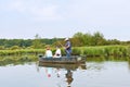 Tourists floating in boat in Briere marsh, France