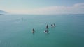 Tourists floating on SUP Board in blue sea. Clip. Top view of group of people on SUP-Boards floating in quiet clear sea