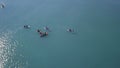 Tourists floating on SUP Board in blue sea. Clip. Top view of group of people on SUP-Boards floating in quiet clear sea