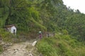 Tourists follow the trail among the mountains of Nepal Himalayas