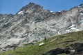 Tourists following path in mountains. Royalty Free Stock Photo