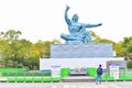 Tourists in Front of the Peace Statue at Nagasaki Peace Park