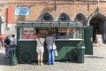 Tourists in front of a stand selling french fries in the market square in the center of Bruges, a beautiful medieval town in Belgi Royalty Free Stock Photo