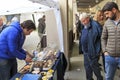 Tourists in front of a truffles vendor at the Truffle fair of Moncalvo, Italy