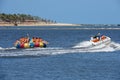 Tourists on a fun boat at Barra de Cunhau on Brazil