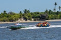 Tourists on a fun boat at Barra de Cunhau on Brazil