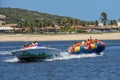 Tourists on a fun boat at Barra de Cunhau on Brazil