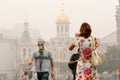 Tourists in a gas mask at the Red Square