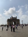 Tourists at the Gateway of India & Taj Mahal Hotel, Mumbai Royalty Free Stock Photo