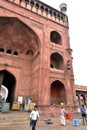 Tourists at the gateway of the Jama Masjid Mosque