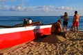 Tourists gather around an outrigger Royalty Free Stock Photo