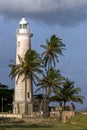 Tourists gather at the base of the lighthouse at Point Utrecht Bastion in Galle in Sri Lanka.