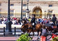 Tourists gather at the gates of Buckingham Palace