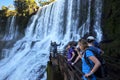 Tourists gather at a waterfall on the Argentinian side of the Iguazu Falls.