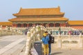 Tourists gathering in front of the Gate of Supreme Harmony