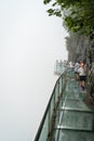 Tourists on a glass walk in China