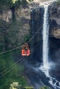 Tourists gliding on the zip line trip in Cascades route, Banos Royalty Free Stock Photo