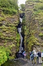 Tourists at Gljufrabui waterfall in Iceland Royalty Free Stock Photo