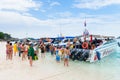 Tourists go on board the speed boat on the beach Royalty Free Stock Photo