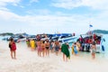 Tourists go on board the speed boat on the beach Royalty Free Stock Photo