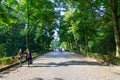 Tourists go to sculpture of Grieving Mother in famous Treptow Park, Berlin, Germany