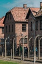 Oswiencim, Poland - September 21, 2019: Tourists going trought the gate of the nazi concentration camp of Auschwitz