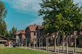 Oswiencim, Poland - September 21, 2019: Tourists going trought the gate of the nazi concentration camp of Auschwitz