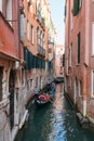 Tourists on Gondola on the canals of Venice, Italy Royalty Free Stock Photo