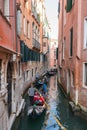 Tourists on Gondola on the canals of Venice, Italy Royalty Free Stock Photo