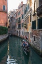 Tourists on Gondola on the canals of Venice, Italy Royalty Free Stock Photo