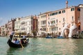 Tourists at a gondola in front of the hands sculpture created by Spanish artist Lorenzo Quinn in the Venice Grand Canal to call at