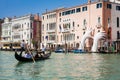 Tourists at a gondola in front of the hands sculpture created by Spanish artist Lorenzo Quinn in the Venice Grand Canal to call at