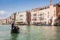 Tourists at a gondola in front of the hands sculpture created by Spanish artist Lorenzo Quinn in the Venice Grand Canal to call at