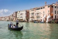 Tourists at a gondola in front of the hands sculpture created by Spanish artist Lorenzo Quinn in the Venice Grand Canal to call at