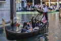 Tourists in a gondola, Venice, Italy Royalty Free Stock Photo