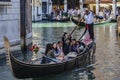 Tourists in a gondola, Venice, Italy