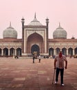 Tourists in the grounds of the Jama Masjid Mosque